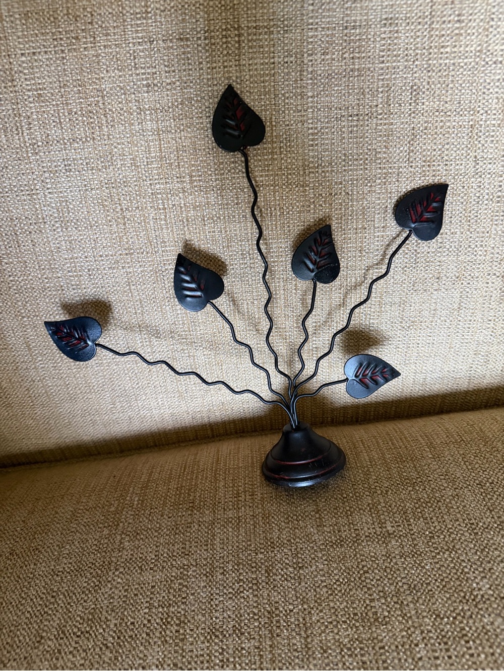 Black Metal Leaf Table Decor with Red Accents